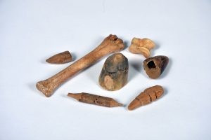 A small selection of wood and bone toys, part of the Harborough Toys collection.